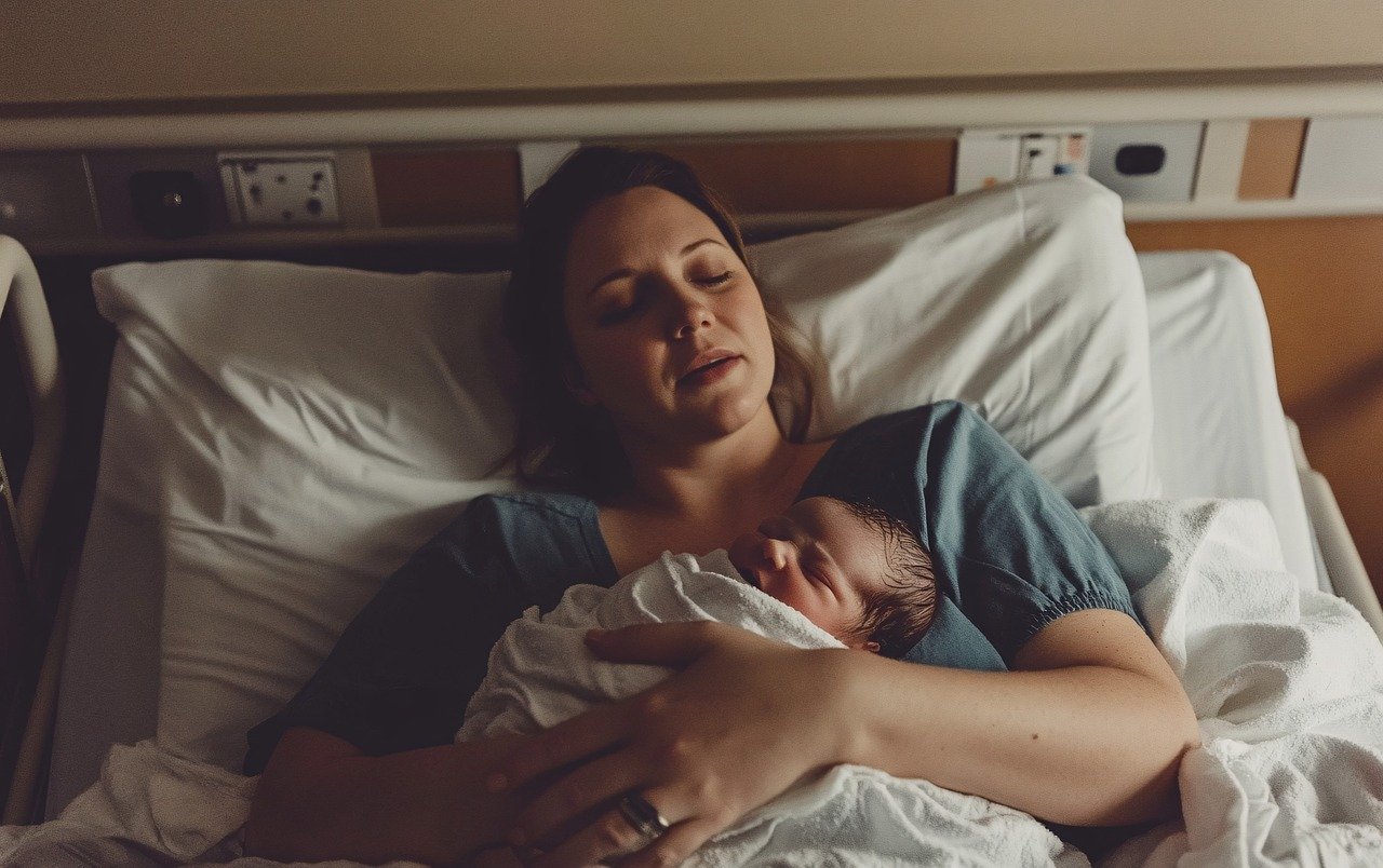Photo by Vilkasss ai generated, mother, baby, newborn, hospital, infant, child, woman, parent, family, care, maternity, motherhood, love, bed, birth, postpartum, health, medical, patient, room, people, female, young, adult