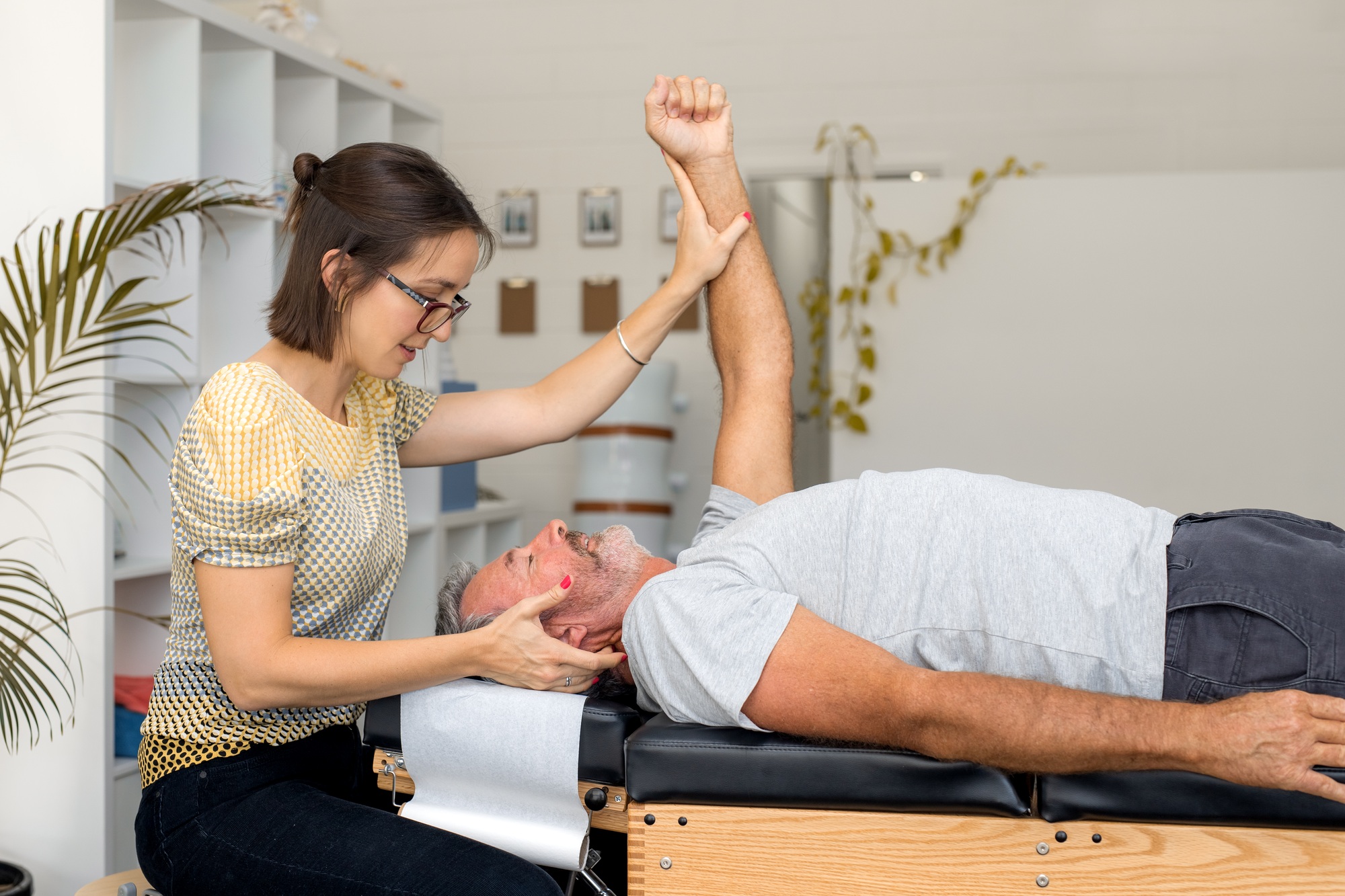 Senior man having chiropractic adjustment